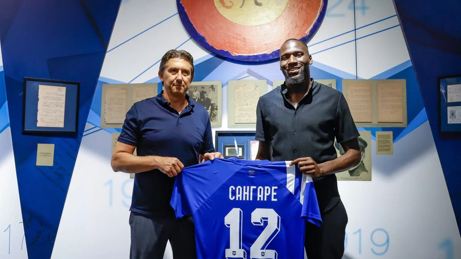 Archive: Mustafa Sangare on the right at his Levski signing in July 2024; not a photograph of the current injury or Arda match. Official club photograph cropped to 16:9 with original faces and shirt marks preserved.